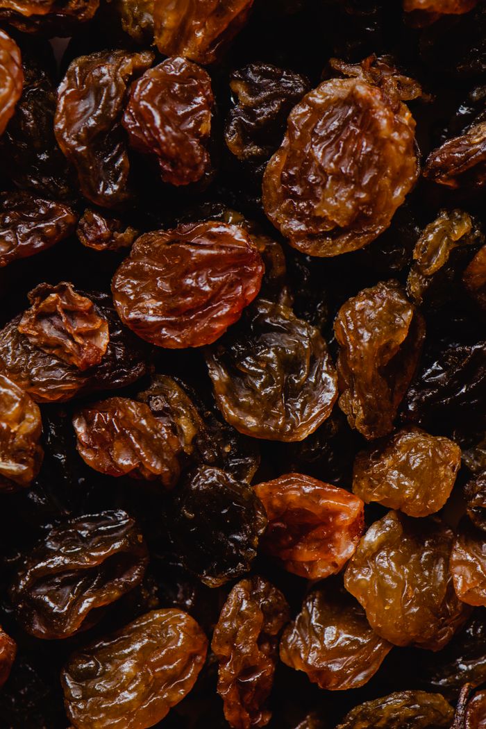 Detailed close-up of organic raisins, showcasing their rich texture and natural hues.